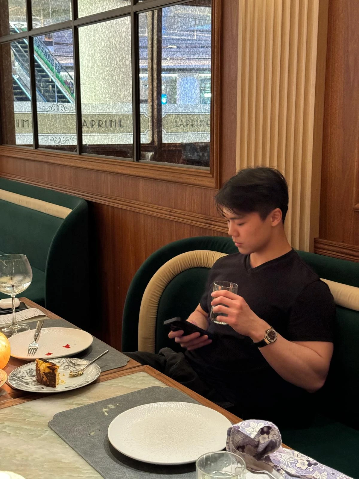 Bono Ngai seated beside a window